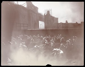 Girls working on a rooftop vegetable garden, Manhattan Bridge visible beyond, New York, 1910